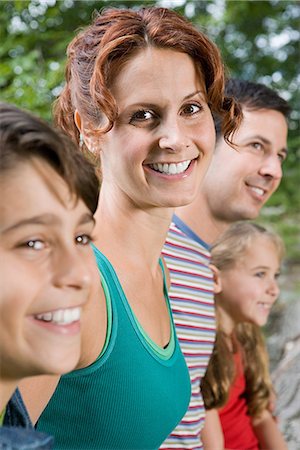 father son camping woods - Woman and her family Stock Photo - Premium Royalty-Free, Code: 6116-08945753