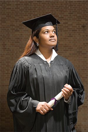 Female graduate holding a diploma Stock Photo - Premium Royalty-Free, Code: 6116-08945805