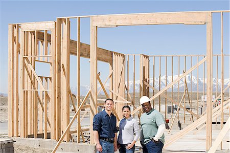 Portrait of builders on a construction site Stock Photo - Premium Royalty-Free, Code: 6116-08915384