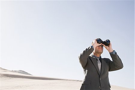 simsearch:700-00661362,k - Businessman in desert with binoculars Stock Photo - Premium Royalty-Free, Code: 6116-08915484