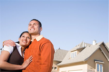 people in mountain home - Portrait of a couple outside of a house Stock Photo - Premium Royalty-Free, Code: 6116-08915413