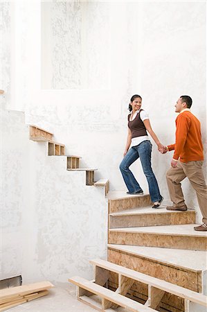 pacific islander at home - A couple walking up stairs Stock Photo - Premium Royalty-Free, Code: 6116-08915419