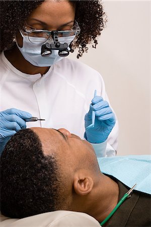 simsearch:693-06014951,k - Man having teeth examined Stock Photo - Premium Royalty-Free, Code: 6116-08915574