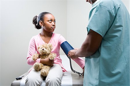 doctor checking pulse to patient - Girl having a check up Stock Photo - Premium Royalty-Free, Code: 6116-08915777
