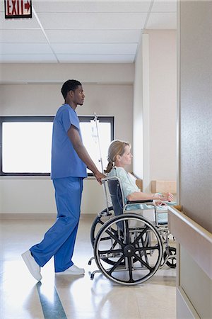 Nurse with patient in wheelchair Photographie de stock - Premium Libres de Droits, Code: 6116-08915738