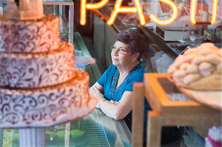 senior woman with cake - Bakery shop owner Stock Photo - Premium Royalty-Free, Code: 6116-08916006