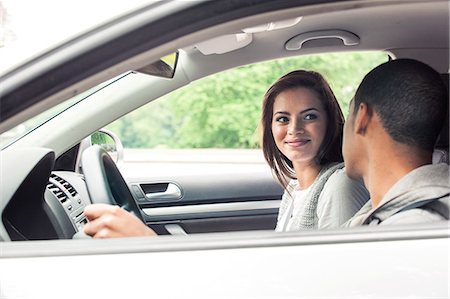 excited african american in a car - Teenagers driving car Stock Photo - Premium Royalty-Free, Code: 6116-08916024