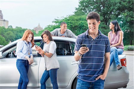 driving texting woman - Teenagers with car Stock Photo - Premium Royalty-Free, Code: 6116-08916039