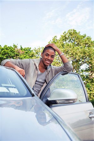 fun teenagers gifting - Teenagers with car Stock Photo - Premium Royalty-Free, Code: 6116-08916103