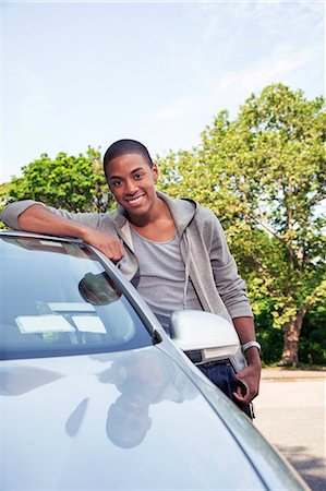 excited african american in a car - Teenagers with car Stock Photo - Premium Royalty-Free, Code: 6116-08916104