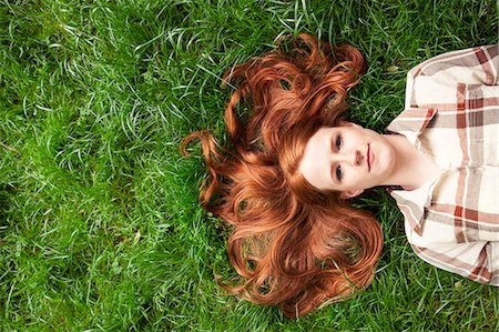 someone laying down aerial view - Teenage girl laying in grass Stock Photo - Premium Royalty-Free, Code: 6116-08916124