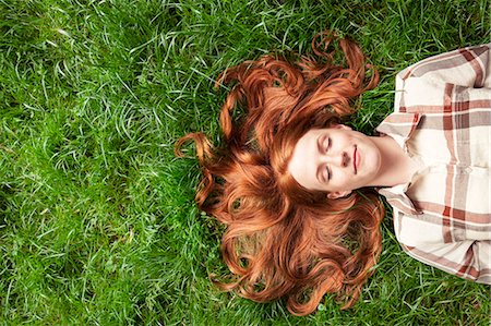 someone laying down aerial view - Teenage girl laying in grass Stock Photo - Premium Royalty-Free, Code: 6116-08916126