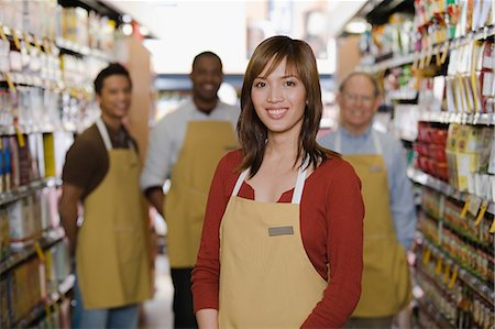 picture of a black woman at the grocery store - Portrait of sales assistant Stock Photo - Premium Royalty-Free, Code: 6116-09013498