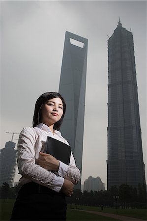 simsearch:6116-09013518,k - Chinese businesswoman near skyscrapers Stock Photo - Premium Royalty-Free, Code: 6116-09013554