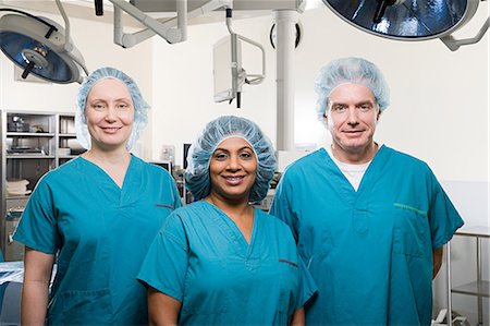 Surgeons in operating theatre Stock Photo - Premium Royalty-Free, Code: 6116-09013562