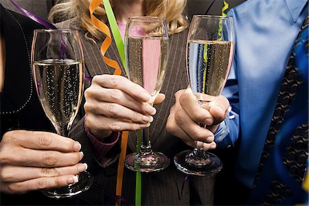 Office workers celebrating with champagne Stock Photo - Premium Royalty-Free, Code: 6116-09013673