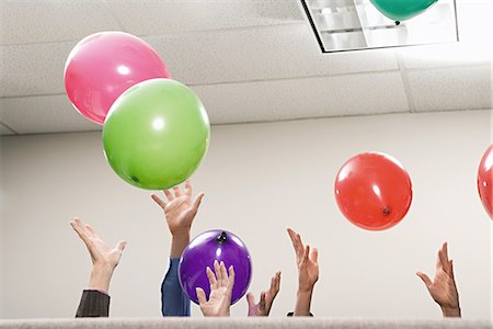 simsearch:640-03260171,k - Office workers playing with balloons Stock Photo - Premium Royalty-Free, Code: 6116-09013674