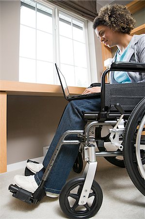 disabled female student - Disabled woman using a laptop computer Stock Photo - Premium Royalty-Free, Code: 6116-09013608