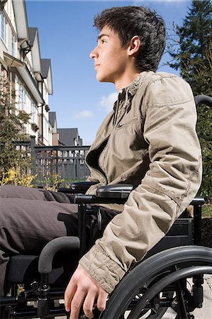 Profile of a disabled teenage boy Stock Photo - Premium Royalty-Free, Code: 6116-09013614