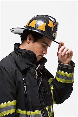 simsearch:614-02763979,k - Firefighter tipping his hat Photographie de stock - Premium Libres de Droits, Code: 6116-09013726