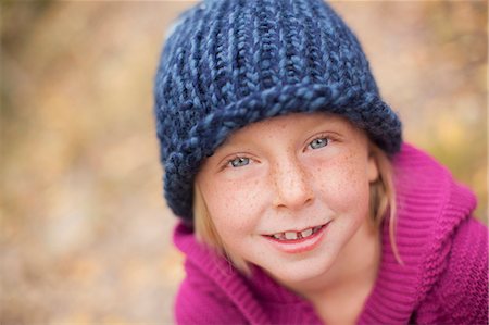 simsearch:693-07444529,k - A Girl In A Knitted Hat, And Magenta Jumper With A Folded Collar. Stock Photo - Premium Royalty-Free, Code: 6118-07121900