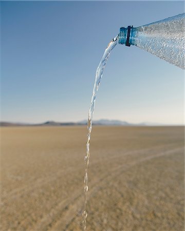 The Landscape Of The Black Rock Desert In Nevada. A Bottle Of Water Being Poured Out. Filtered Mineral Water. Stockbilder - Premium RF Lizenzfrei, Bildnummer: 6118-07122058