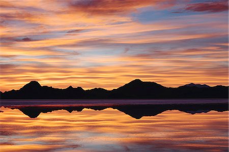 simsearch:6118-07122048,k - The Sky At Sunset. Layers Of Cloud Reflecting In The Shallow Waters Flooding The Bonneville Salt Flats Stock Photo - Premium Royalty-Free, Code: 6118-07122072