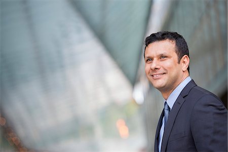 front person business smile - Business People. A Latino Businessman In Business Clothes. Stock Photo - Premium Royalty-Free, Code: 6118-07122026