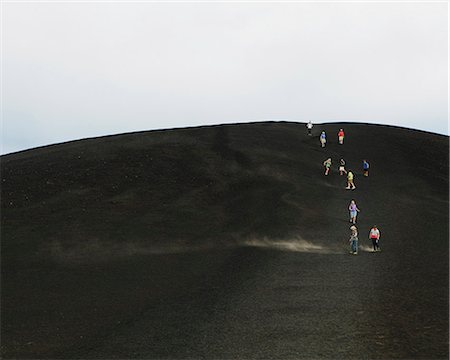 simsearch:6118-07122107,k - A Black Volcanic Cone Hillside In The Craters Of The Moon National Monument And Preserve In Butte County Idaho. People Walking On The Slope. Stock Photo - Premium Royalty-Free, Code: 6118-07122103