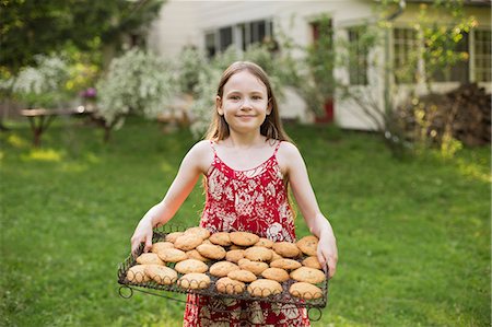 food tray - Baking Homemade Cookies. A Young Girl Holding A Tray Of Fresh Baked Cookies. Stock Photo - Premium Royalty-Free, Code: 6118-07122242