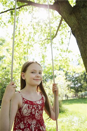 simsearch:6118-08220592,k - Summer. A Girl In A Sundress On A Swing In An Orchard. Stockbilder - Premium RF Lizenzfrei, Bildnummer: 6118-07122208