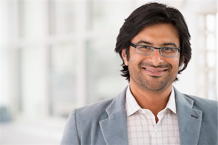 Business People. A Man In A Light Jacket Wearing Glasses. Photographie de stock - Premium Libres de Droits, Code: 6118-07122367