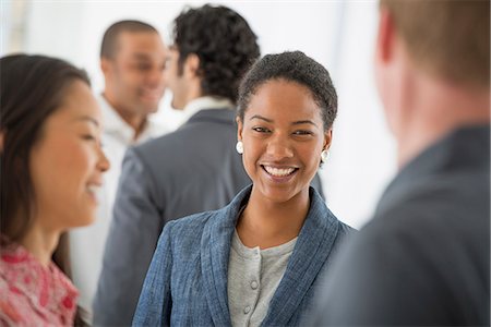 Business. A Team Of People, A Multi Ethnic Group, Men And Women In A Group. Photographie de stock - Premium Libres de Droits, Code: 6118-07122579