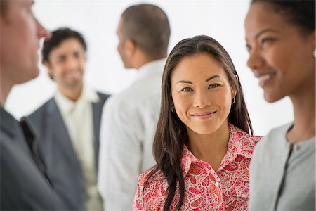 Business. A Team Of People, A Multi Ethnic Group, Men And Women In A Group. Photographie de stock - Premium Libres de Droits, Code: 6118-07122581