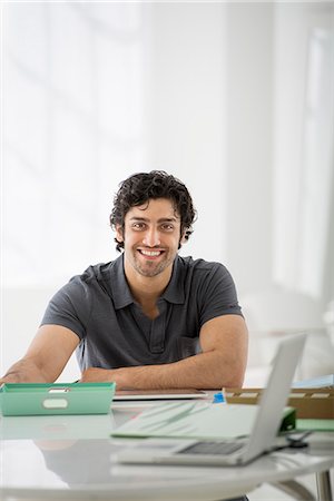 sure - Business. A Man Sitting In A Relaxed Pose Behind A Desk. Stock Photo - Premium Royalty-Free, Code: 6118-07122617