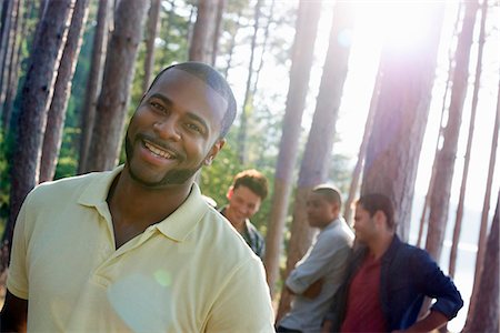 simsearch:6118-07352726,k - Lakeside. A group of people, friends gathered in the shade of pine trees in summer. Photographie de stock - Premium Libres de Droits, Code: 6118-07203557