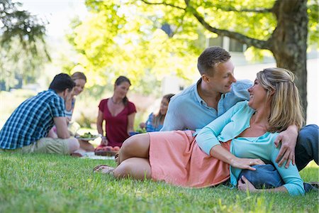 simsearch:6118-07203927,k - A group of adults and children sitting on the grass under the shade of a tree. A family party. Stock Photo - Premium Royalty-Free, Code: 6118-07203616