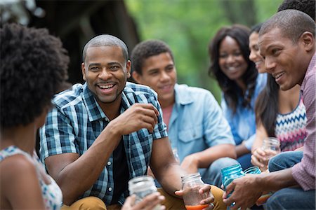 summer buffet - A group of men and women outdoors enjoying themselves. Stock Photo - Premium Royalty-Free, Code: 6118-07203760