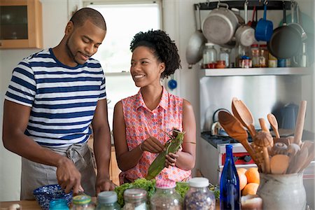 row of houses usa - Lifestyle. Two people working in a farmhouse kitchen. Stock Photo - Premium Royalty-Free, Code: 6118-07203804