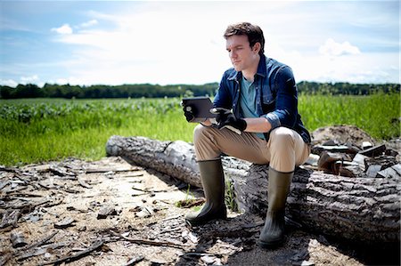 farming in usa - A farmer working in his fields in New York State, USA. Stock Photo - Premium Royalty-Free, Code: 6118-07203901