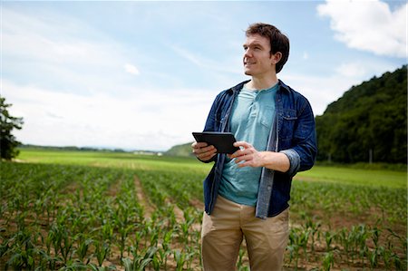 farm chores - A farmer working in his fields in New York State, USA. Stock Photo - Premium Royalty-Free, Code: 6118-07203906