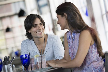 restaurant in us - A cafe interior. A couple seated at a table. Stock Photo - Premium Royalty-Free, Code: 6118-07235078