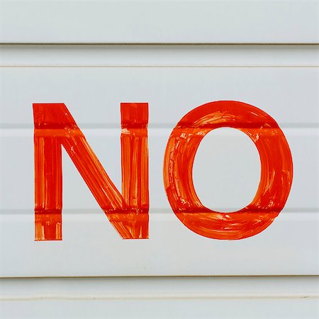 simsearch:6118-07203257,k - A large NO sign in red paint on a garage door, indicating No Parking. Stock Photo - Premium Royalty-Free, Code: 6118-07351302