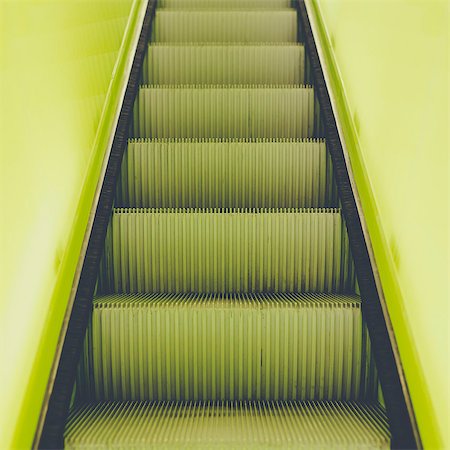 simsearch:6118-07351305,k - A flight of steps, an escalator with a yellow painted border stripe on each side. Stock Photo - Premium Royalty-Free, Code: 6118-07351308