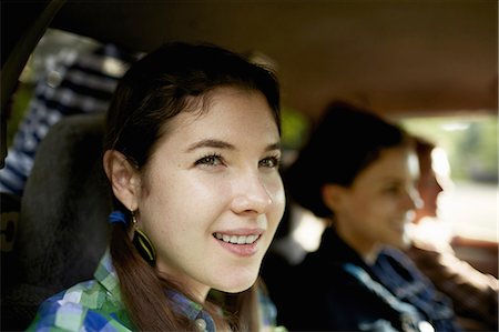 pick up truck and man - Three passengers in the cab of a pickup truck. One young man driving. Two young women sitting beside him. Stock Photo - Premium Royalty-Free, Code: 6118-07351667