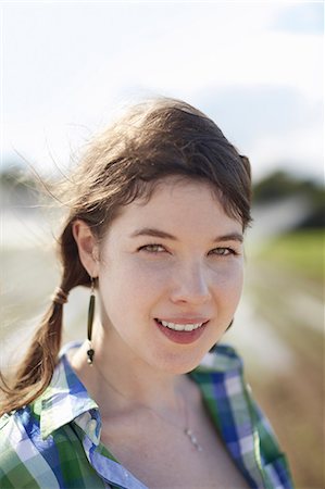 simsearch:6118-07351638,k - A young woman with braids wearing a green and blue plaid shirt. Photographie de stock - Premium Libres de Droits, Code: 6118-07351665