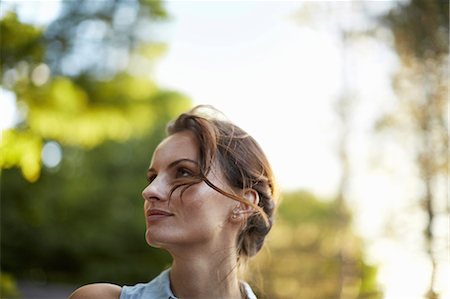 scenic landscape with woman - A young woman in the woods at dusk. Stock Photo - Premium Royalty-Free, Code: 6118-07351691