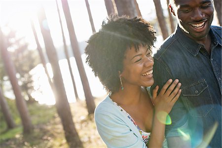 real people - A happy couple in a shady spot in woodland in summer. Hugging and holding each other. Stock Photo - Premium Royalty-Free, Code: 6118-07351608