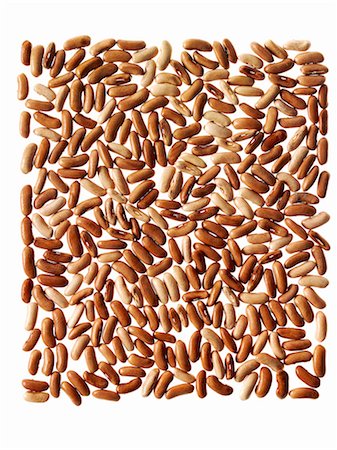 rice grains - Grains of rice arranged in a pattern. Photographie de stock - Premium Libres de Droits, Code: 6118-07351748