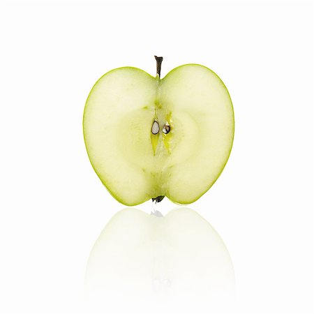 solo objeto - Cross section of an apple, cut in half. Foto de stock - Sin royalties Premium, Código: 6118-07351733